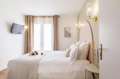 Un ou plusieurs lits dans un hébergement de l'établissement Hôtel Flor