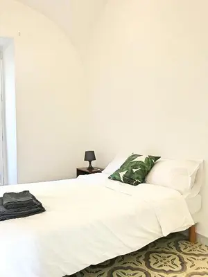 Un ou plusieurs lits dans un hébergement de l'établissement Casa Mandulina - Centre Ancien Vue Mer
