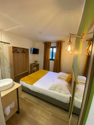 Un ou plusieurs lits dans un hébergement de l'établissement Hotel U Catagnu