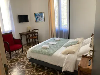 Un ou plusieurs lits dans un hébergement de l'établissement Hôtel La Demeure Coloniale