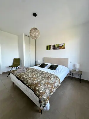 Un ou plusieurs lits dans un hébergement de l'établissement Appartement COCON vue mer