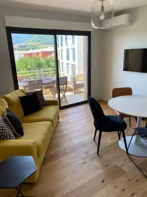 Coin salon dans l'établissement Appartements de Standing - Panate