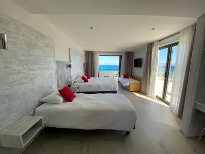 Un ou plusieurs lits dans un hébergement de l'établissement Hôtel L'Isula Marina