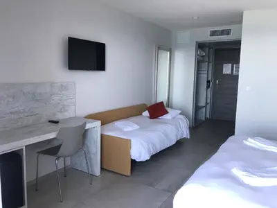 Un ou plusieurs lits dans un hébergement de l'établissement Hôtel L'Isula Marina
