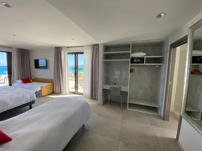Un ou plusieurs lits dans un hébergement de l'établissement Hôtel L'Isula Marina