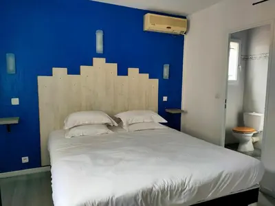 Un ou plusieurs lits dans un hébergement de l'établissement auberge de tesa