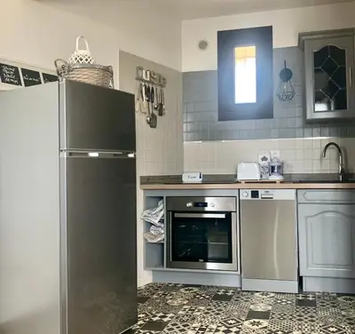 Cuisine ou kitchenette dans l'établissement APPARTEMENT LES COLLINES