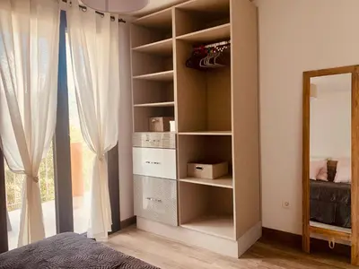 Un ou plusieurs lits dans un hébergement de l'établissement APPARTEMENT LES COLLINES