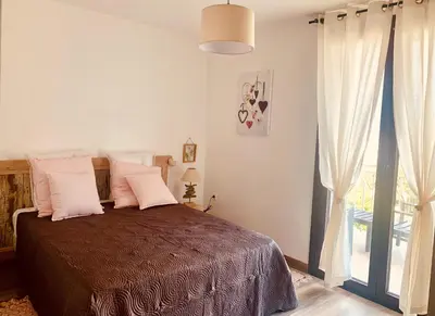 Un ou plusieurs lits dans un hébergement de l'établissement APPARTEMENT LES COLLINES