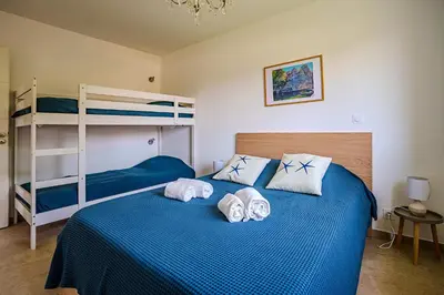 Un ou plusieurs lits dans un hébergement de l'établissement Villa Camille