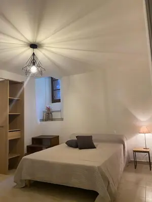 Un ou plusieurs lits dans un hébergement de l'établissement Appartement de charme vieille ville