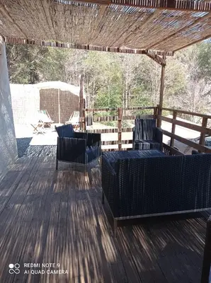 Coin salon dans l'établissement Maisonnette U Santu Ghjuvandria ou A Santa Ghjulia entre mer et Montagne