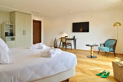 Un ou plusieurs lits dans un hébergement de l'établissement Hôtel & Spa Rocabella