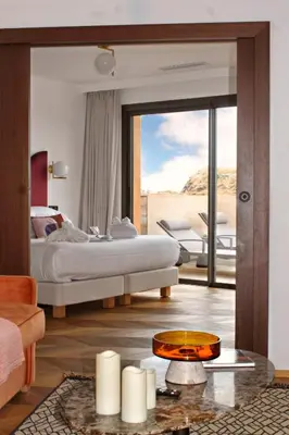 Un ou plusieurs lits dans un hébergement de l'établissement Hôtel & Spa Rocabella