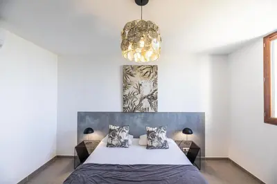 Un ou plusieurs lits dans un hébergement de l'établissement La Listrella Residence & Spa