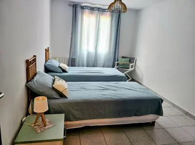 Un ou plusieurs lits dans un hébergement de l'établissement Cap Corse une villa dans un nid de verdure
