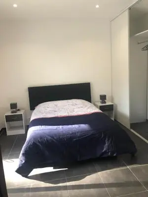 Un ou plusieurs lits dans un hébergement de l'établissement T3 moderne et spacieux à BASTIA