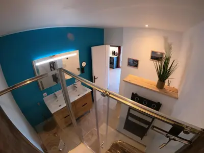 Télévision ou salle de divertissement dans l'établissement Le Clos des Milans