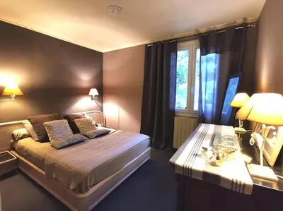 Un ou plusieurs lits dans un hébergement de l'établissement Casa Galli- Belle villa coeur de ville avc piscine