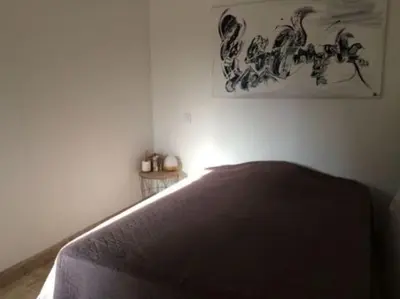 Un ou plusieurs lits dans un hébergement de l'établissement Petite maison en pierre