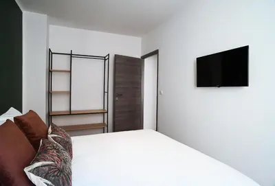 Un ou plusieurs lits dans un hébergement de l'établissement Sognu di Matteu - Bel appartement entièrement climatisé - vue mer, vieux port Bastia