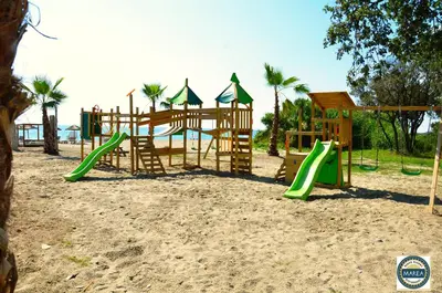 Aire de jeux pour enfants de l'établissement apartment on the sea - Moriani beach