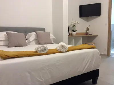 Un ou plusieurs lits dans un hébergement de l'établissement STUDIO A 2 MIN DES PLAGES