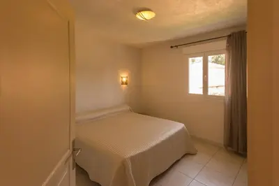 Un ou plusieurs lits dans un hébergement de l'établissement Residence de tourisme Le clos des Vendanges