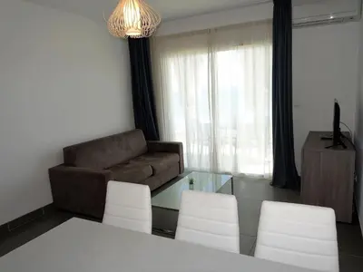Coin salon dans l'établissement Apartment T3 vue cap by Interhome