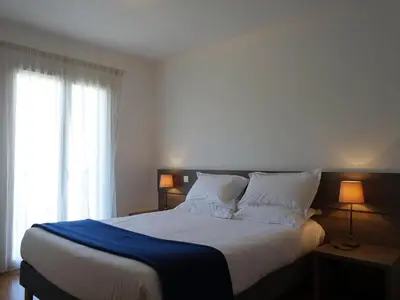 Un ou plusieurs lits dans un hébergement de l'établissement Apartment T3 vue baie by Interhome