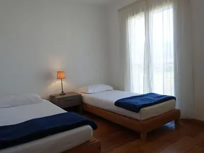 Un ou plusieurs lits dans un hébergement de l'établissement Apartment T3 vue baie by Interhome
