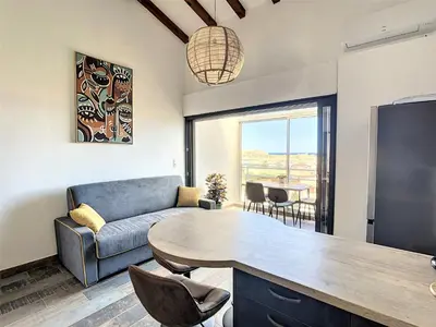 Coin salon dans l'établissement Très Beau Duplex vue panoramique Mer, Proche Plage