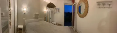Un ou plusieurs lits dans un hébergement de l'établissement Charmante petite maison dans résidence avec piscine chauffée à 600 m de la plage