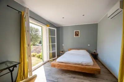 Un ou plusieurs lits dans un hébergement de l'établissement Villa Anna location de vacances au Calme en Corse à proximité de Calvi
