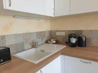Cuisine ou kitchenette dans l'établissement Appartement A Caserella entièrement rénové avec terrasse et vue panoramique sur mer