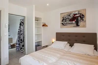 Un ou plusieurs lits dans un hébergement de l'établissement appartement Levante au calme piscine chauffée partagée et bbq
