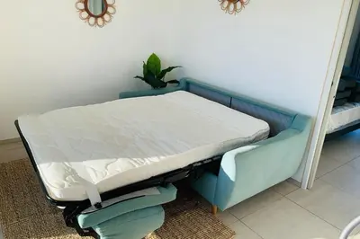 Un ou plusieurs lits dans un hébergement de l'établissement appartement Levante au calme piscine chauffée partagée et bbq
