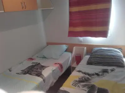 Un ou plusieurs lits dans un hébergement de l'établissement Mobil-Home dans lotissement très tranquille