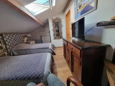 Télévision ou salle de divertissement dans l'établissement Maison Le Rêve