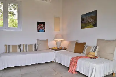 Un ou plusieurs lits dans un hébergement de l'établissement Domaine Punta della Guardia villa panorama maquis et mer, plage à 1,5 Km