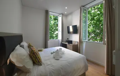 Un ou plusieurs lits dans un hébergement de l'établissement Hôtel Continental