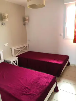 Un ou plusieurs lits dans un hébergement de l'établissement MAISONNETTE 6 PERS PROCHE L'ILE ROUSSE