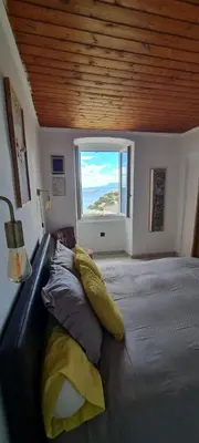 Un ou plusieurs lits dans un hébergement de l'établissement pietranera village terrasse vue exceptionnelle sur la mer