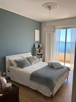 Un ou plusieurs lits dans un hébergement de l'établissement Appartement face à la mer