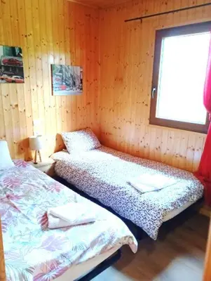 Un ou plusieurs lits dans un hébergement de l'établissement Chalet de Santa