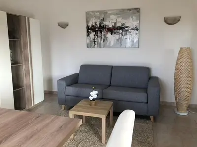 Coin salon dans l'établissement Appartement rez de villa
