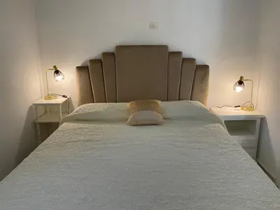 Un ou plusieurs lits dans un hébergement de l'établissement MINI VILLA BORD DE MER