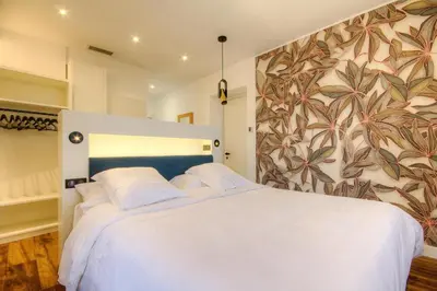 Un ou plusieurs lits dans un hébergement de l'établissement Hôtel Casale Olmia
