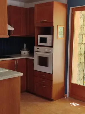 Cuisine ou kitchenette dans l'établissement Les bergeries de Montestremo