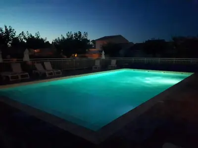 Piscine de l'établissement Villa climatisée A Nuciola Prunete Entre mer, montagne et piscine ou située à proximité